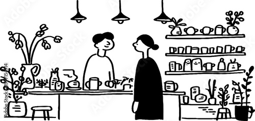 Person speaking with barista across counter in cafe