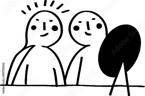 Two people looking at mirror on tabletop in studio setting