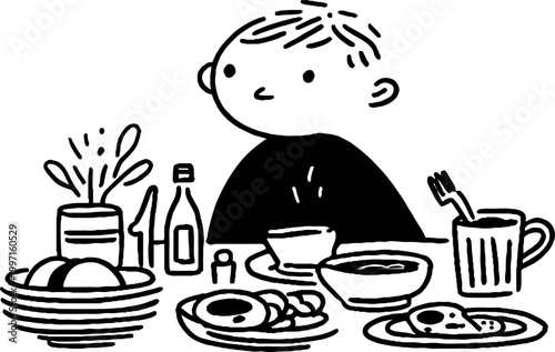 Child sitting at breakfast table with assorted food items