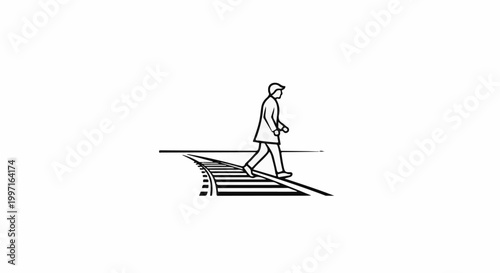 A person in a coat and cap crosses railroad tracks at a pedestrian crossing