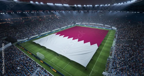 Professional Stadium With Soccer Game Championship With Flag of Qatar Spread Across Pitch Before Football Match Start. Cheering Crowds of Fans Ring the Arena in a Tense Spectacle. Aerial Static Shot