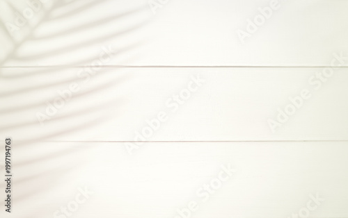 Minimal light wooden background with soft natural shadows and clean neutral aesthetic