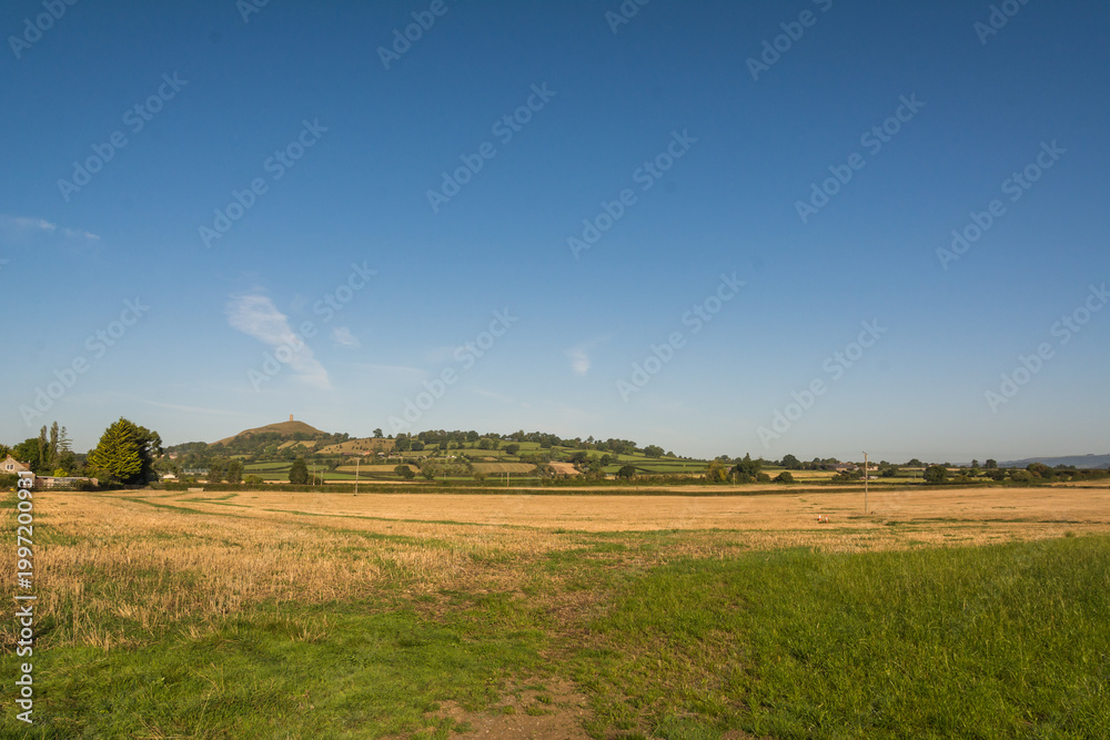 Fototapeta premium Historic St Michaels Tower on Glastonbury Tor Hill under Clear Blue Sky 