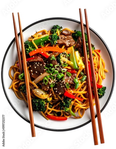 Top-down shot of a flavorful Asian-inspired stir-fry, featuring noodles, meat, colorful vegetables, and sesame seeds in a white bowl, with chopsticks