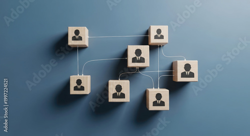Wooden blocks with person icons connected by strings represent a network or team collaboration on a blue background