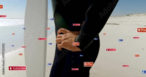 Standing surfer in black wetsuit, hand on hip at beach, with white surfboard and overlay labels