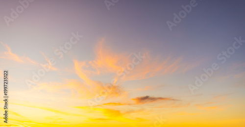 Принти на полотні Dramatic Golden Sunset over Scattered Clouds with Blue Sky Gradient,A breathtaki