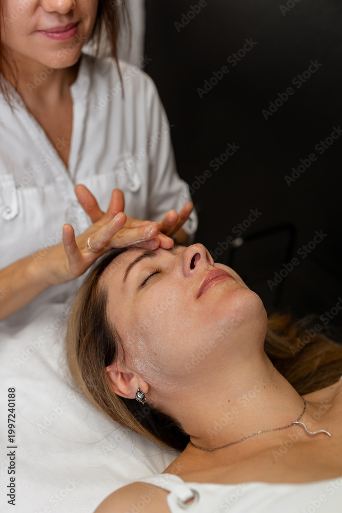 Naklejka premium Facial Massage Treatment in Beauty Spa