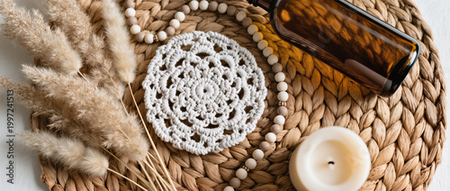 Boho Decor Flatlay with Macrame Coaster, Pampas Grass, Amber Glass Bottle, Ceramic Beads and Neutral Candle on Woven Rattan in Soft Natural Light
