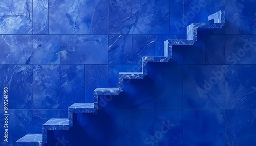 A blue staircase with steps leading up to a wall made of large square tiles
