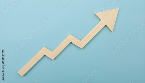 A beige arrow with a zigzag pattern pointing upwards on a light blue background