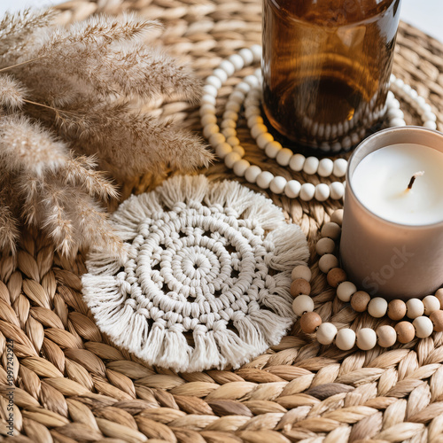Boho Decor Flatlay with Macrame Coaster, Pampas Grass, Amber Glass Bottle, Ceramic Beads and Neutral Candle on Woven Rattan in Soft Natural Light