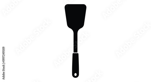 A simple black spatula icon displayed on a white background silhouette