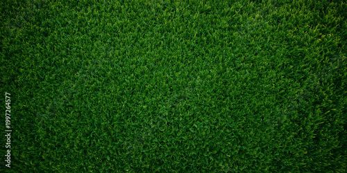 Vibrant green football field turf close-up texture background
