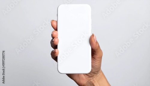 Hand holding blank smartphone with empty white screen for interface mockup, mobile app display, digital communication, user experience design