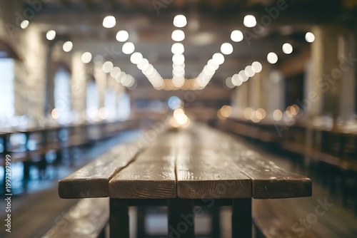 Empty rustic wood table and blurred soft light table in restaurant with bokeh background. product display template.Business presentation.