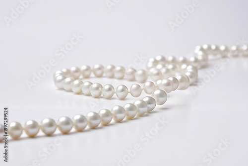 Elegant Pearls Arranged in a Straight Line on a White Surface for Display