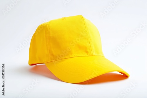 Bright Yellow Cap Placed on a Table With Colorful Background in View