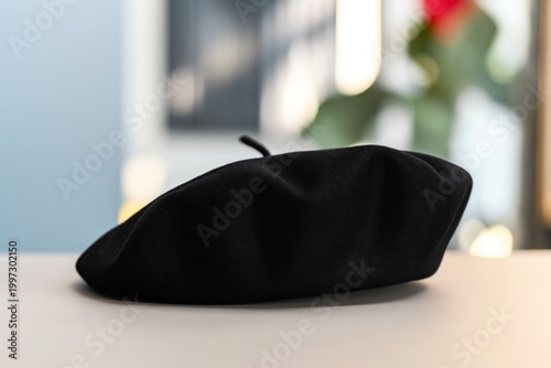 Black Beret Placed on a Table at a Cafe During a Bright Morning