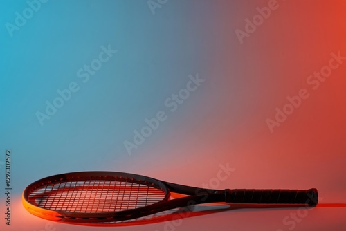 Close View of a Tennis Racket on a Flat Surface With Bright Colors and a Defi...