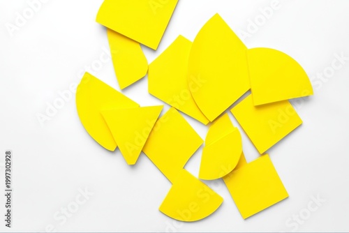 Colorful Yellow Shapes Arranged on a White Background in a Creative Design