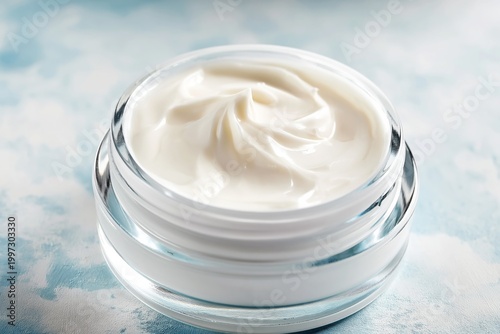 Cream Container Sits on a Soft Surface With Shadows Falling Across the Lid Du...