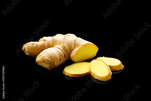 Fresh Ginger Root and Slices on a Black Background in a Simple Food Setting