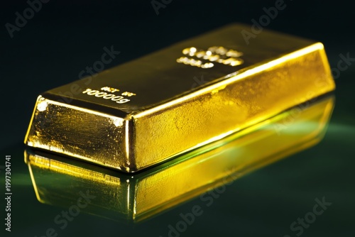Gold Bar Lying on a Reflective Surface Showing Weight and Purity Details