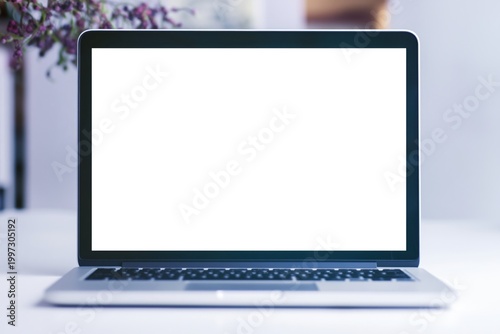 Blank Laptop Screen on a Table With Flowers in the Background During Daylight