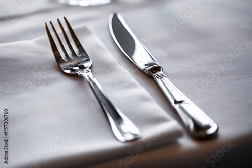 Setting a Dining Table With Fork and Knife on a White Napkin in a Restaurant