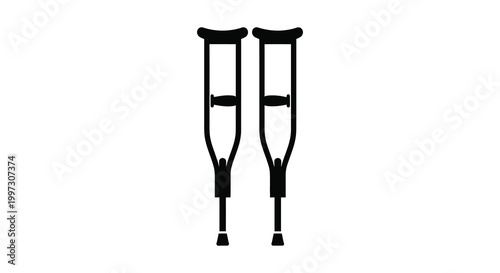 A pair of black crutches stand upright against a white background silhouette
