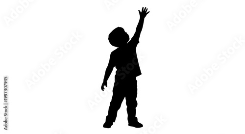Child reaching upwards with arm raised a dramatic silhouette