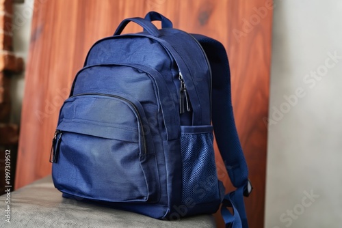 Navy Blue Backpack With Multiple Pockets and Zippers on a White Background