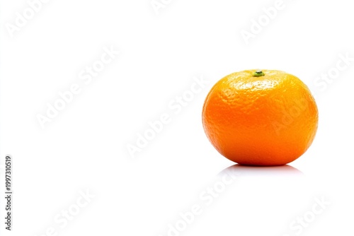 Orange Sits on White Surface With Reflection During Bright Light