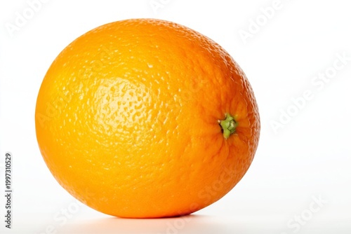 Fresh Orange Sits on a White Surface in a Well-Lit Setting, Showcasing Its Br...
