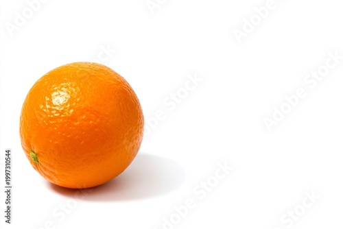 Orange Sits on White Surface With Reflection During Bright Light