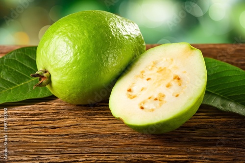 Fresh Guava Fruit on Wooden Surface With Green Background During Daytime