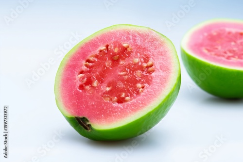 Fresh Guava Fruit Halves on a Plain Background With Seeds Visible Inside