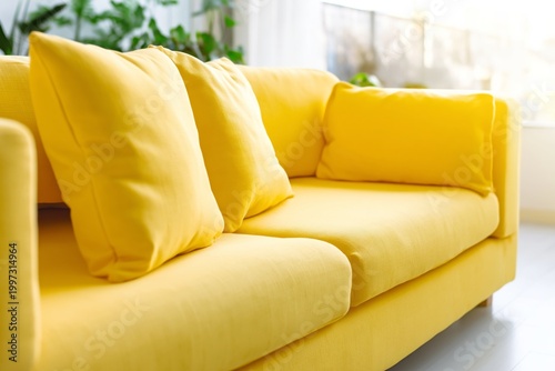 Bright Yellow Sofa in a Living Room With Natural Light and Green Plants Durin...