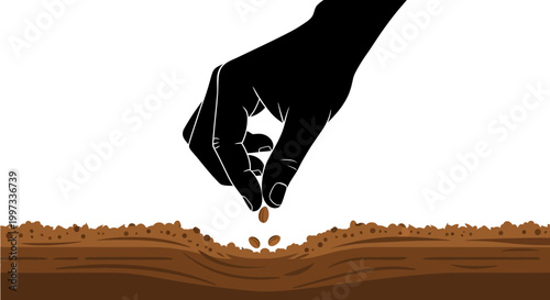 Hand dropping seeds into soil.
