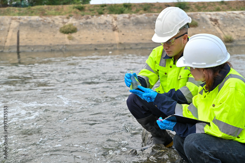 Water Pollution Inspection by Environmental Engineers at Riverbank