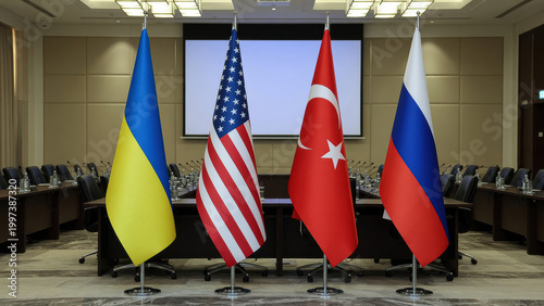 flags of ukraine, usa, turkey and russia on table in conference hall for international negotiation, diplomacy concept, political crisis, peace settlement, delegation meeting, summit dialogue