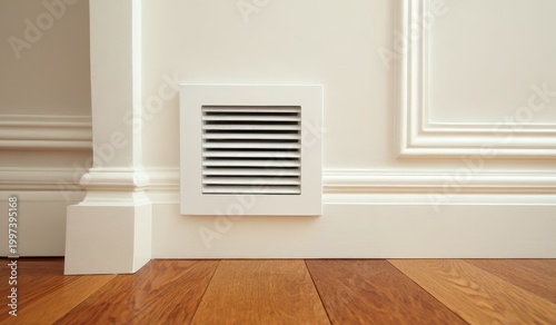 Close-up white air vent installed on wall near the floor. Minimalist Living room background. Modern architecture comfortable living. Air conditioning. Renovation ventilation project. Home improvement