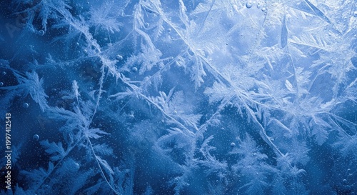 A frozen window with intricate ice patterns and icicles, set against a dark blue background with a subtle glow.