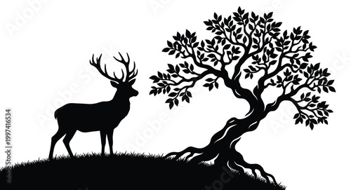 Silhouette of a deer and a tree on a hill