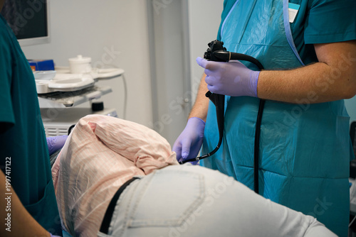 Medical professional examining patient in clinic during daytime