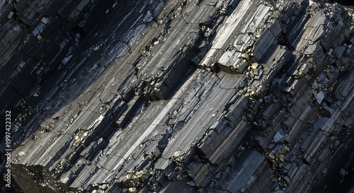 Close-up of a dark, striated mineral specimen with metallic flecks