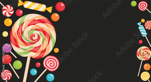Colorful background frame filled with various lollipops, hard candies, and sweets on a dark gray textured surface.