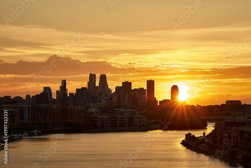 Sunset Over the River With Buildings Reflecting Light in the Evening Sky