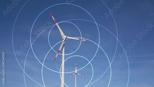 visualization of invisible sound waves around two rotating wind turbines, set against a blue sky, live-action video combined with animation, symbolic noise pollution